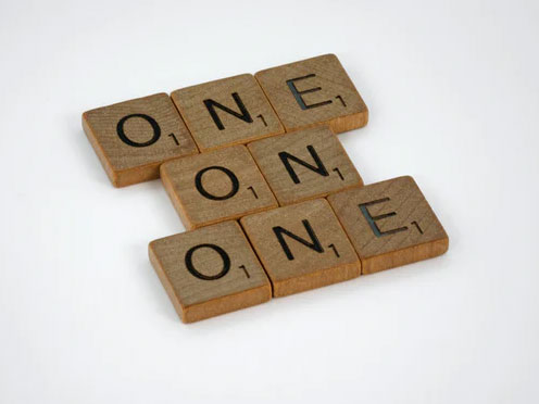 Block letters arranged to spell one-on-one.